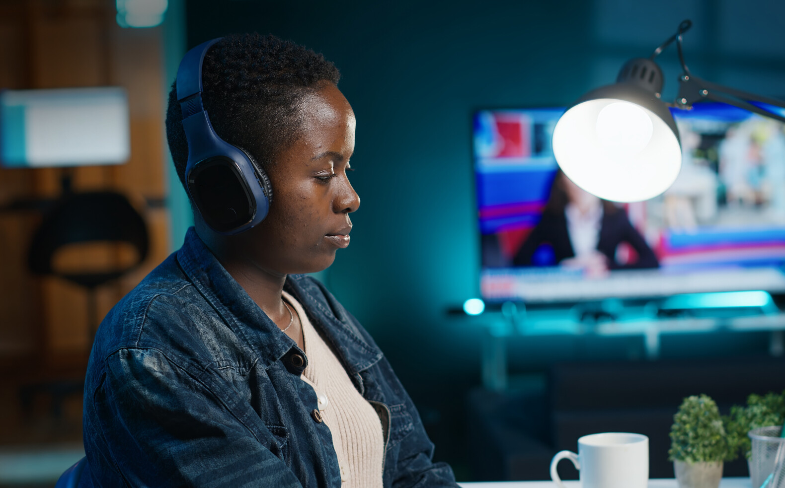 close up video editor putting headphones on